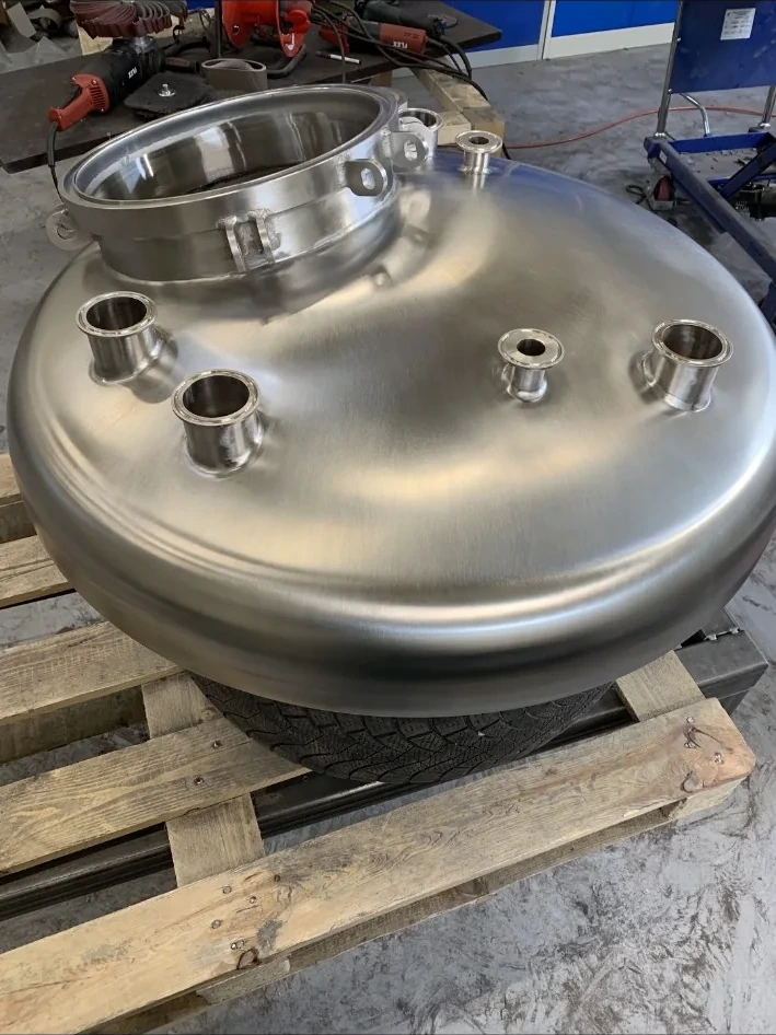 Fabricated stainless steel vessel after surface refinishing and polishing